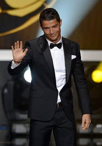 Cristiano Ronaldo waves on stage during the FIFA Ballon d'Or awards ceremony in Zurich on January 7, 2013
